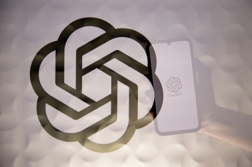 OpenAI logo superimposed on a reflection of a phone